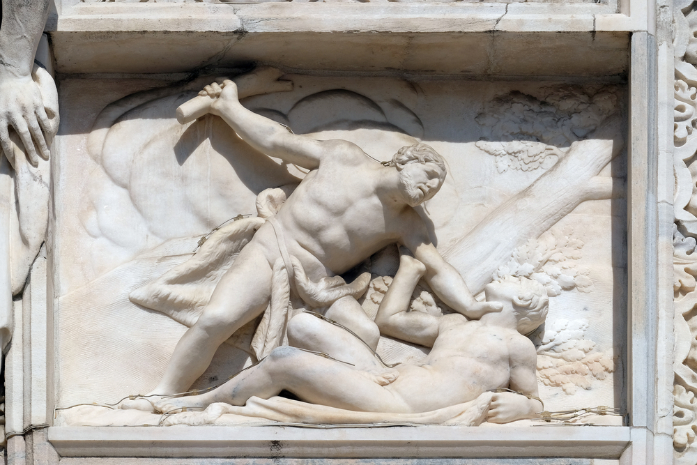 Cain killing Abel, marble relief on the facade of the Milan Cathedral, Duomo di Santa Maria Nascente, Milan, Lombardy, Italy